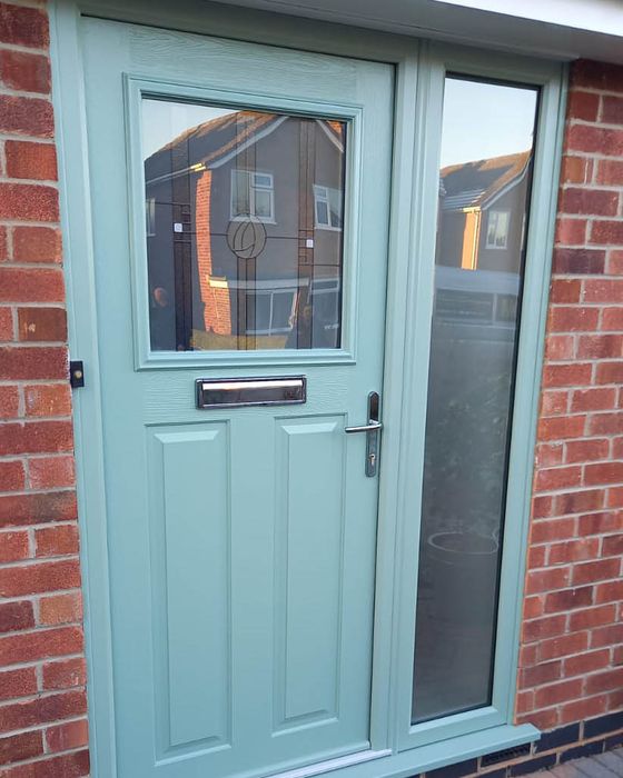 Chartwell green Solidor composite door with Caledonian rose glass in Keyworth