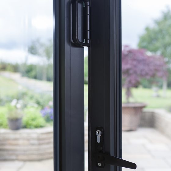 Close detail of a D flat handle and lock on an aluminium bi-fold door